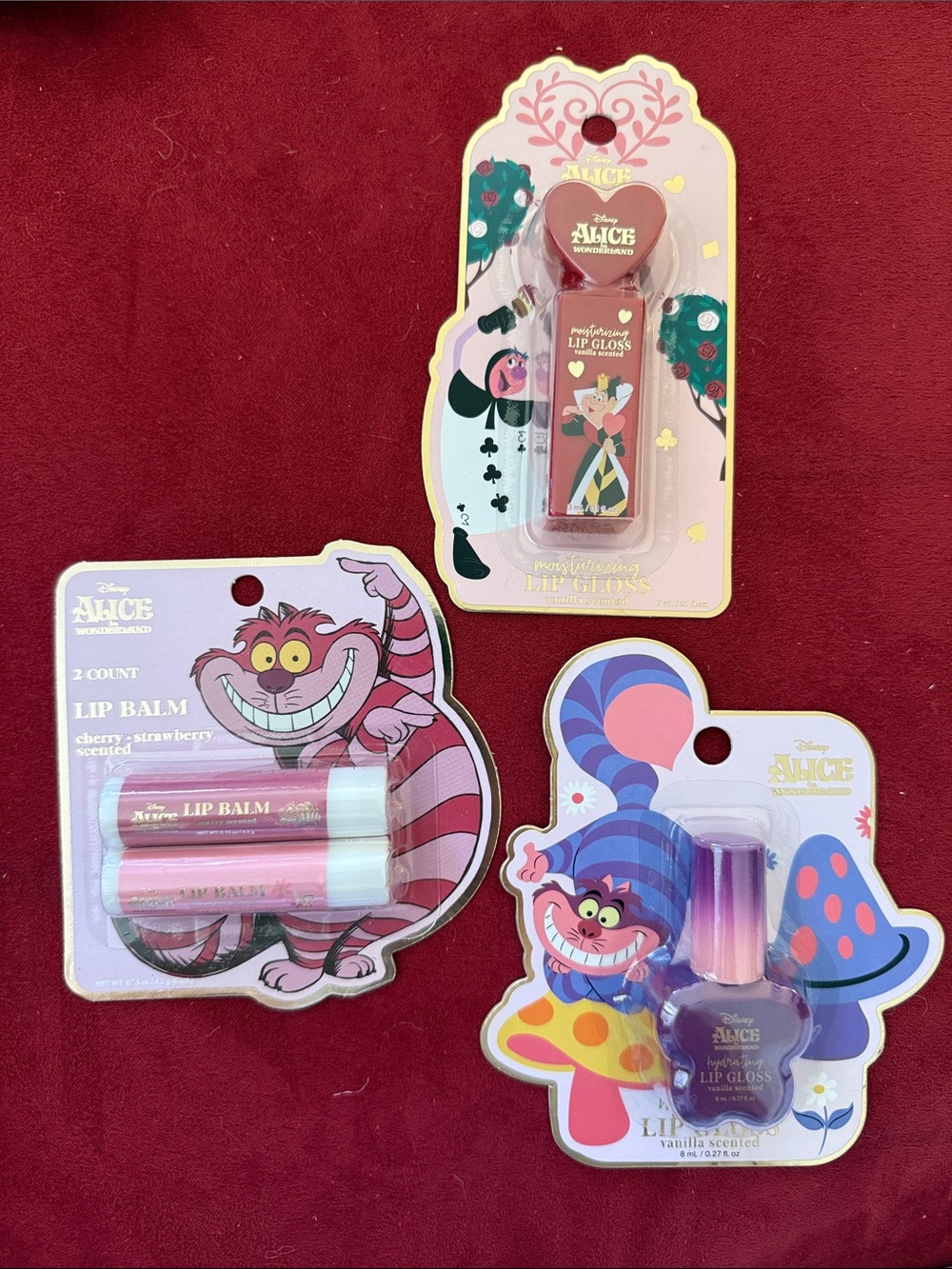 Disney Alice in Wonderland Lip Balms & Glosses Cheshire cat or Queen of Hearts